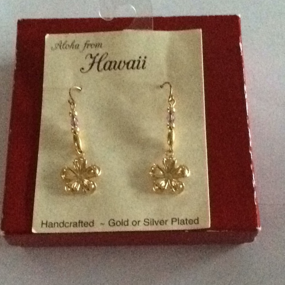 Gold tone plumeria earrings from Hawaii.